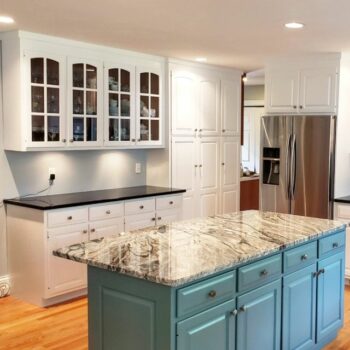 Professional painting company transforming kitchens with beautiful white cabinets