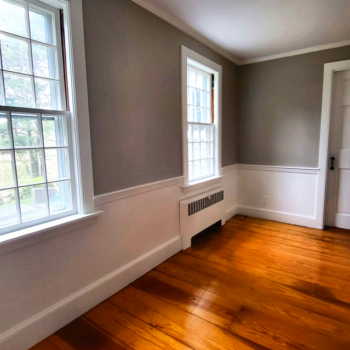 Professional painting company transforming wood-floored rooms